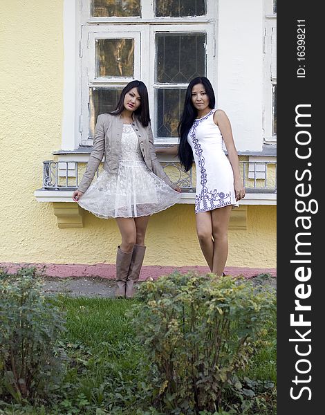 Two female friends walking outdoor