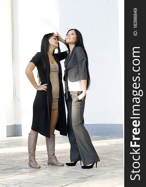 Two female friends walking outdoor