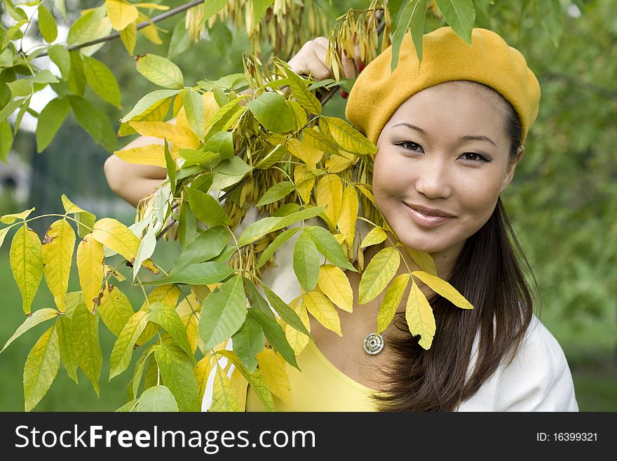 Happy girl walking in autumn park