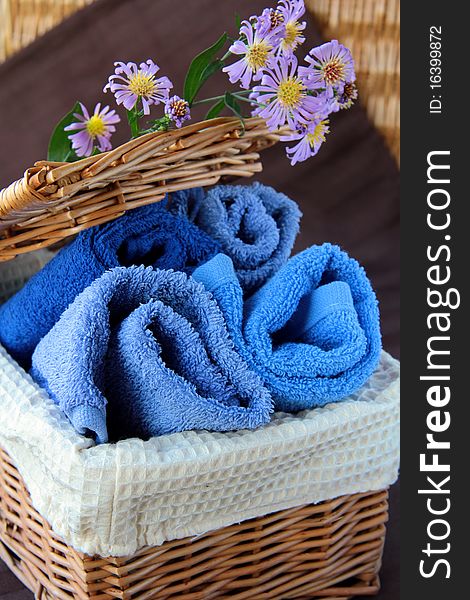 Pile of blue and blue-purple towel with flower