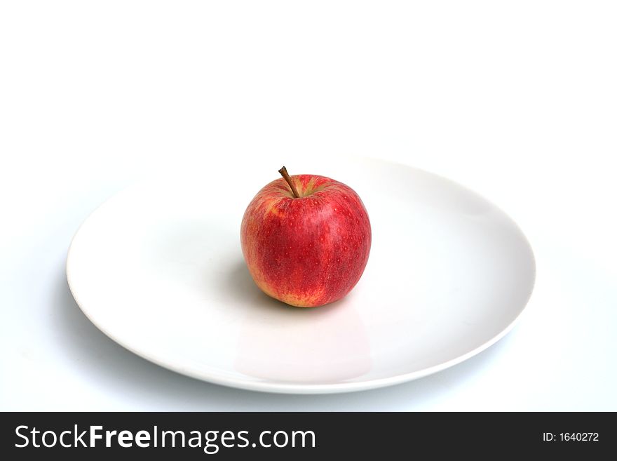Apples shot in various setups on a white plate