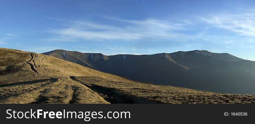Panoramic picture of mountain range in the evening. Panoramic picture of mountain range in the evening
