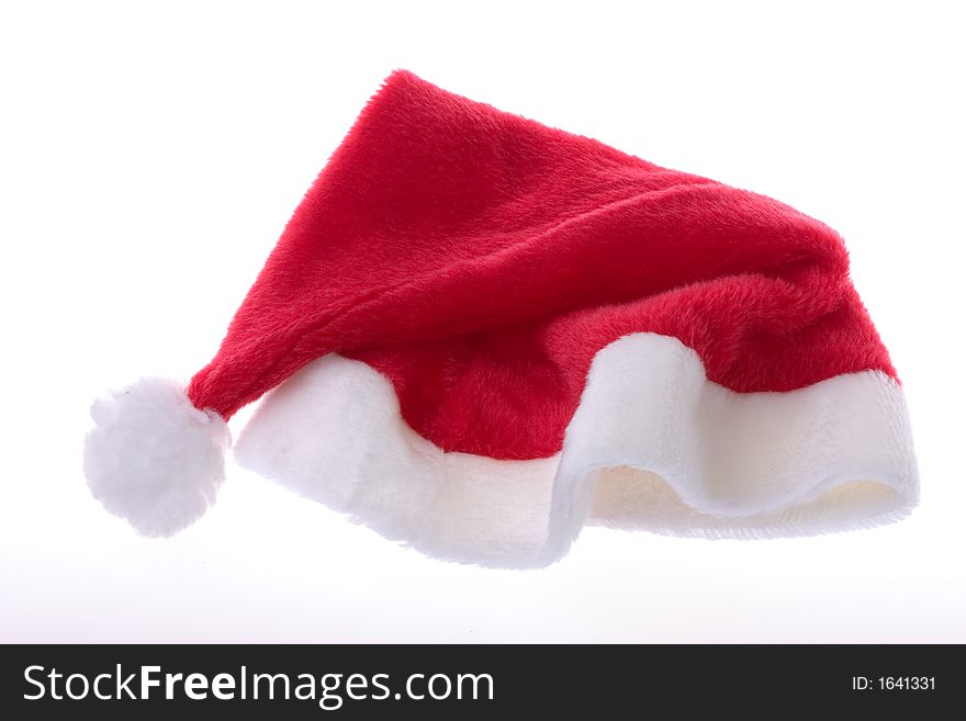 Saint nicks furry red holiday hat on white. Saint nicks furry red holiday hat on white