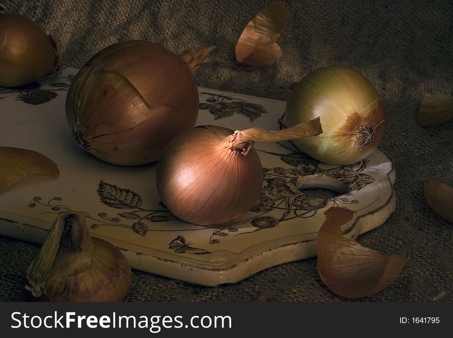Still-life with onions on a sacking