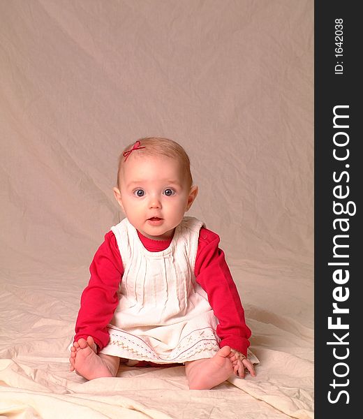 Portrait of little girl with big eyes wearing dress with inquisitive look. Portrait of little girl with big eyes wearing dress with inquisitive look