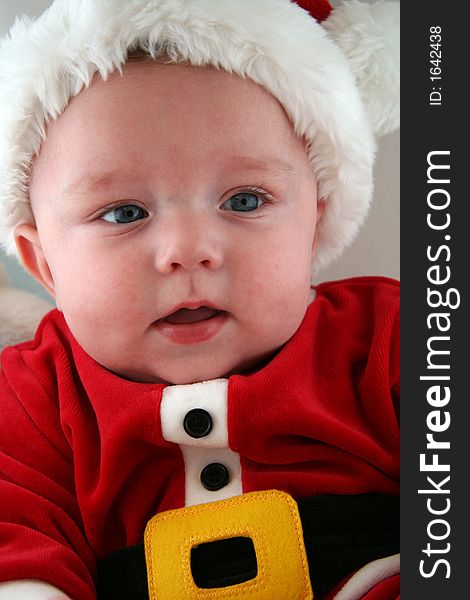 Baby Boy wearing a Santa Claus Outfit and Hat. Baby Boy wearing a Santa Claus Outfit and Hat