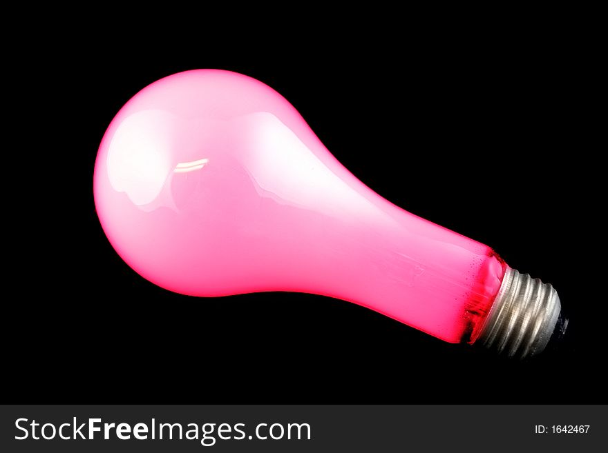 Bright Red Light Bulb on Isolated Black Background