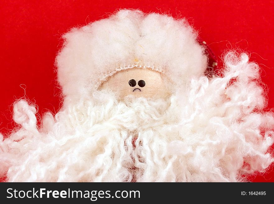 Santa Claus rag doll on a red background. Santa Claus rag doll on a red background.