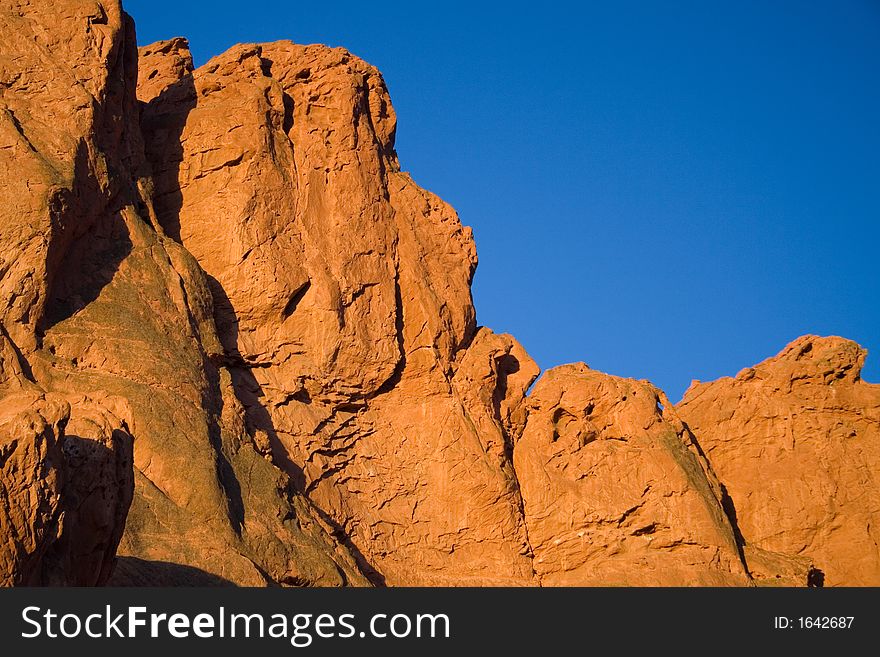 Red rock formation illuminated by the morning sun, taken at the Garden of the Gods park in Colorado Springs.