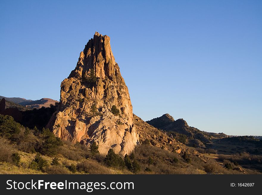 Conical red rock formation from the Garden of the Gods Park in Colorado Springs. Conical red rock formation from the Garden of the Gods Park in Colorado Springs.