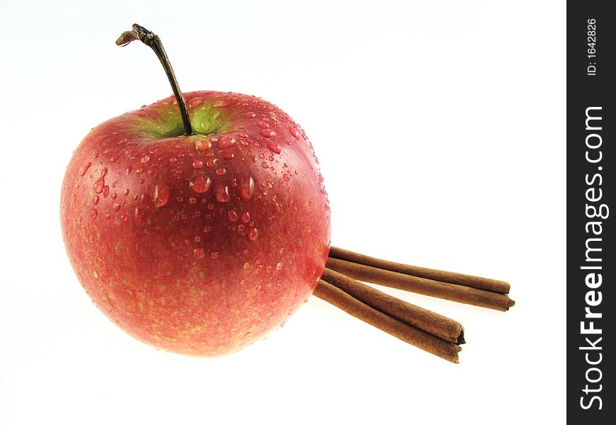 Apple and two sticks of cinnamon. Apple and two sticks of cinnamon