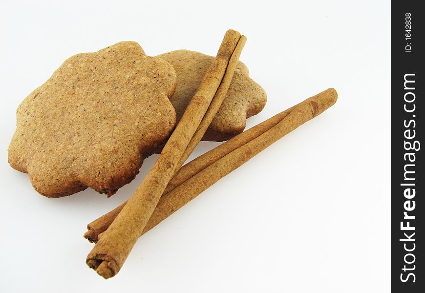 Gingerbreads and two sicks  of  cinnamon. Gingerbreads and two sicks  of  cinnamon