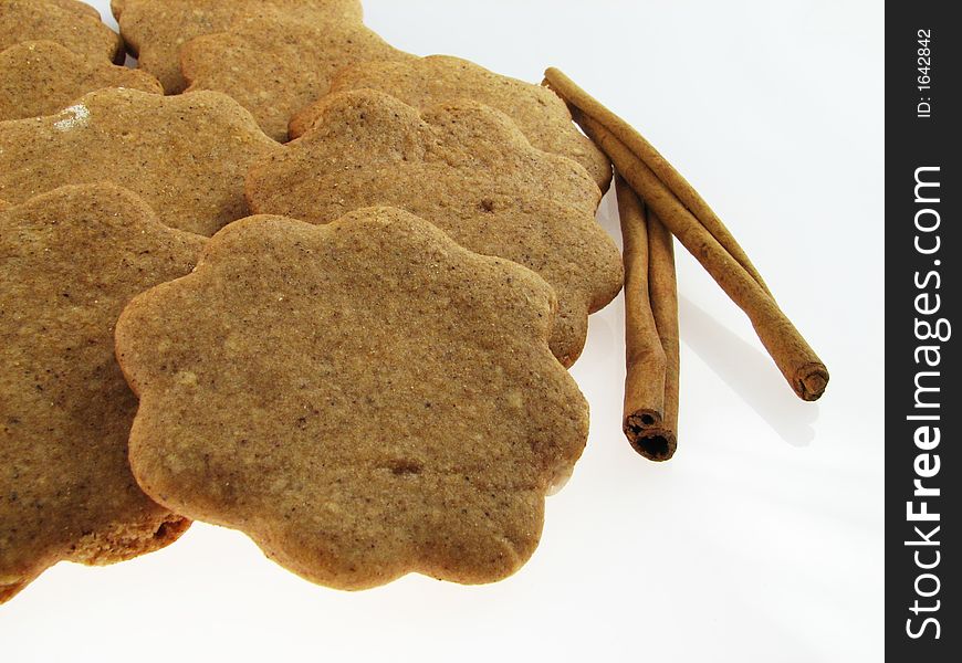 Gingerbreads and two sicks  of  cinnamon. Gingerbreads and two sicks  of  cinnamon