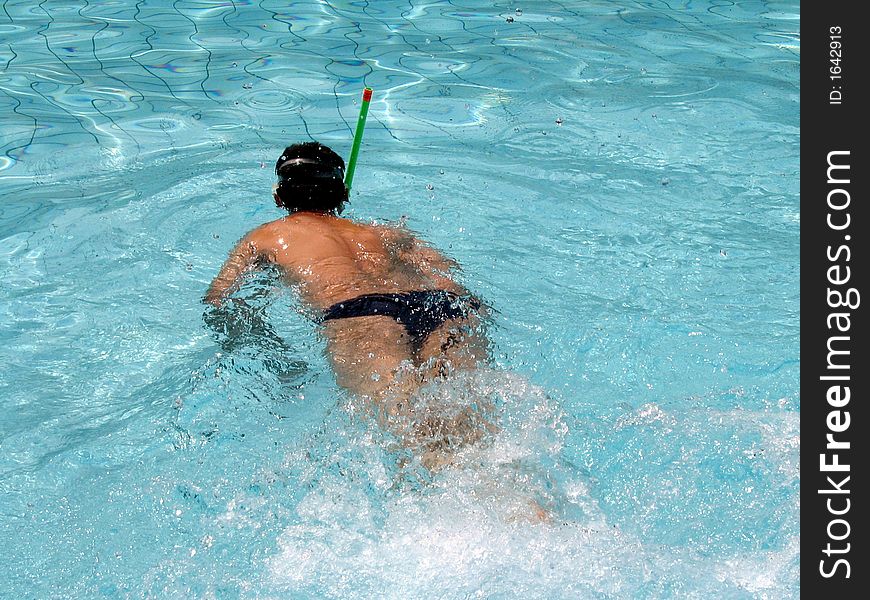 Action in water - Man swiming in pool