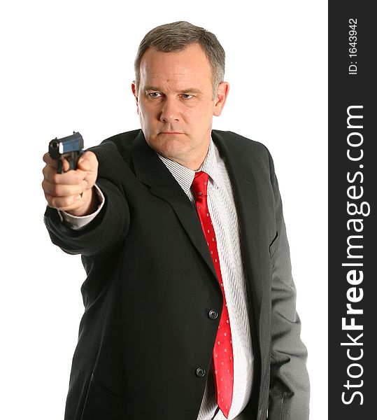 Businessman with suit and tie holds and points handgun isolated on white space. Businessman with suit and tie holds and points handgun isolated on white space