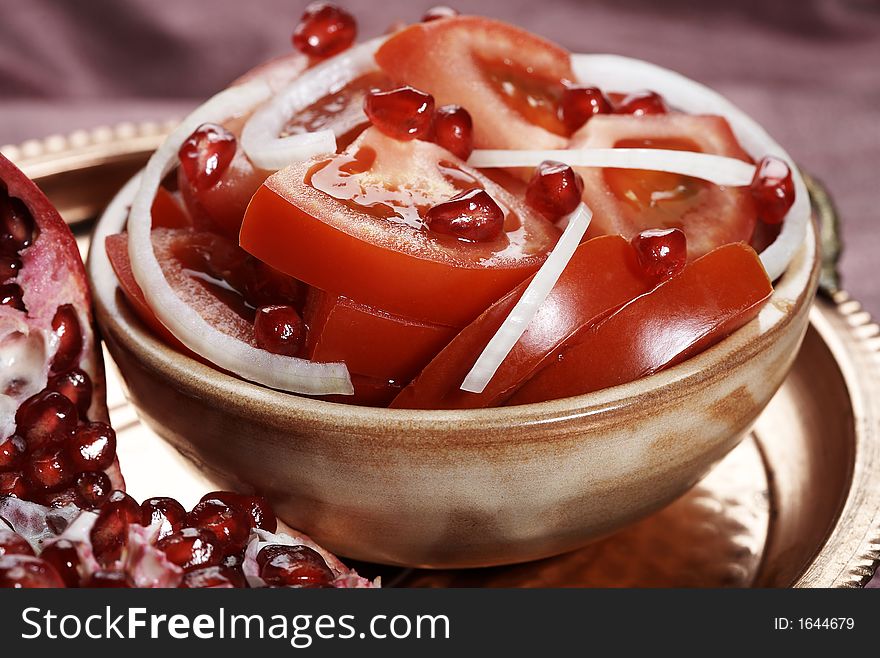 Oriental tomato salad with onion and pomegranate. Oriental tomato salad with onion and pomegranate