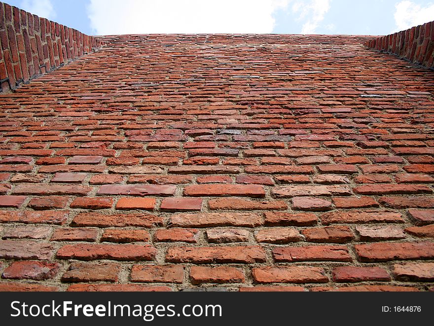 Old wall on blue sky - background