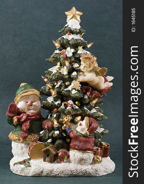 Christmas decoration item under the form of a small Christmas tree with little snow mans.