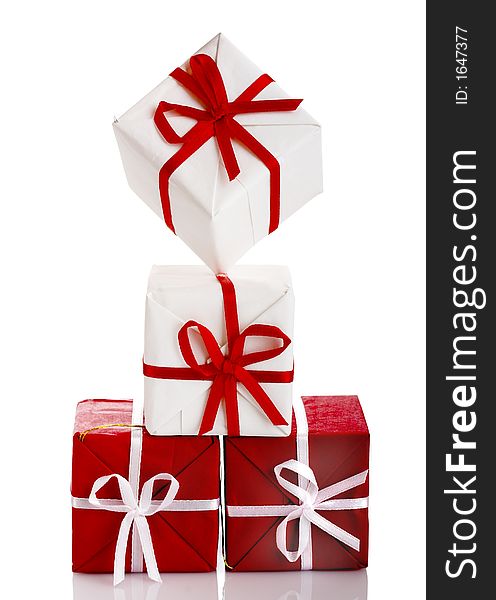 Christmas season! Small gift boxes with reflection. Christmas season! Small gift boxes with reflection
