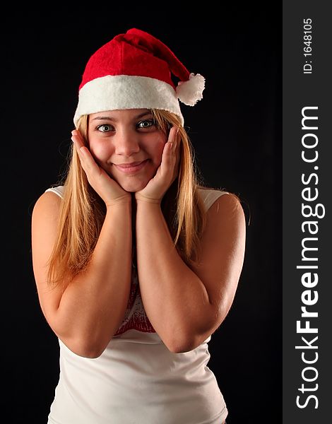 Surprised Christmas blonde girl, black background. Surprised Christmas blonde girl, black background