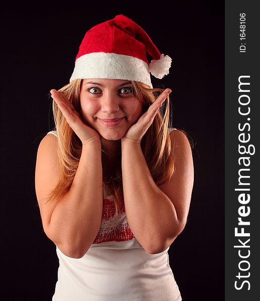 Surprised Christmas blonde girl, black background. Surprised Christmas blonde girl, black background