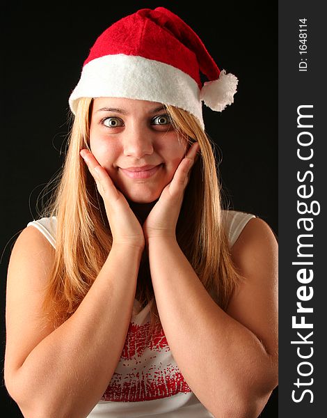 Surprised Christmas blonde girl, black background. Surprised Christmas blonde girl, black background