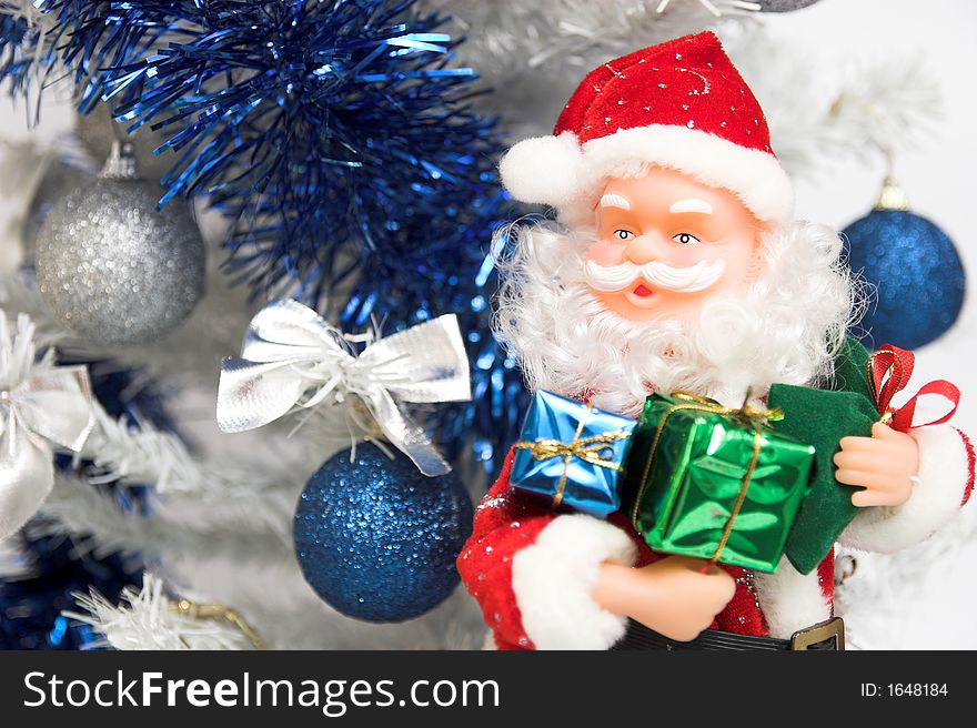 Santa claus with xmas presents and christmas tree. Santa claus with xmas presents and christmas tree