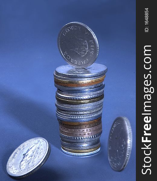 Close up of International Coins falling, studio shot