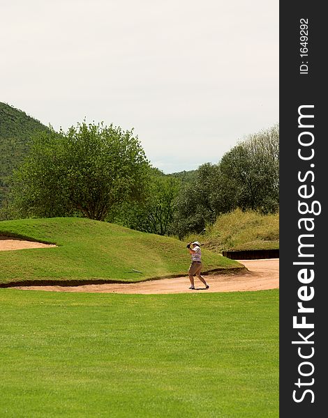 Golfer In The Sand Bunker