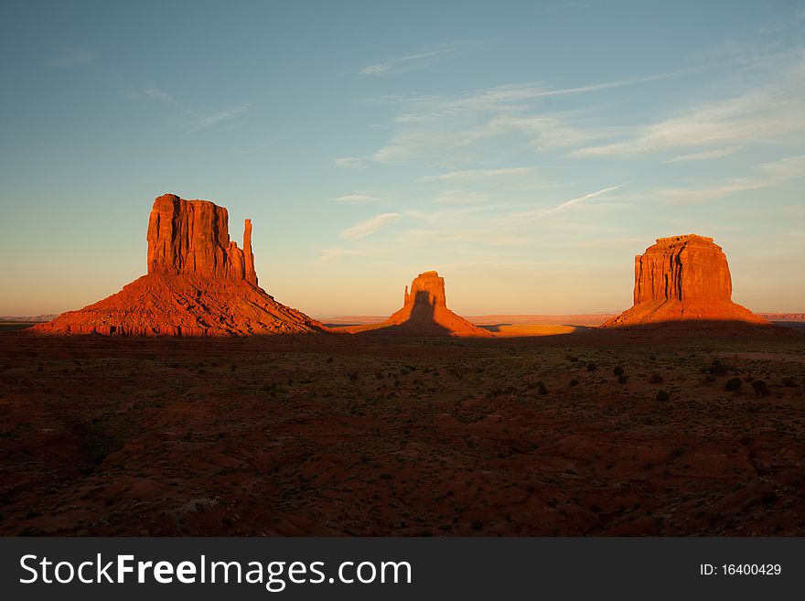 A famous rock formation found in monument valley arizona. The shade of the first mountain is dropping on the second mountain. A famous rock formation found in monument valley arizona. The shade of the first mountain is dropping on the second mountain