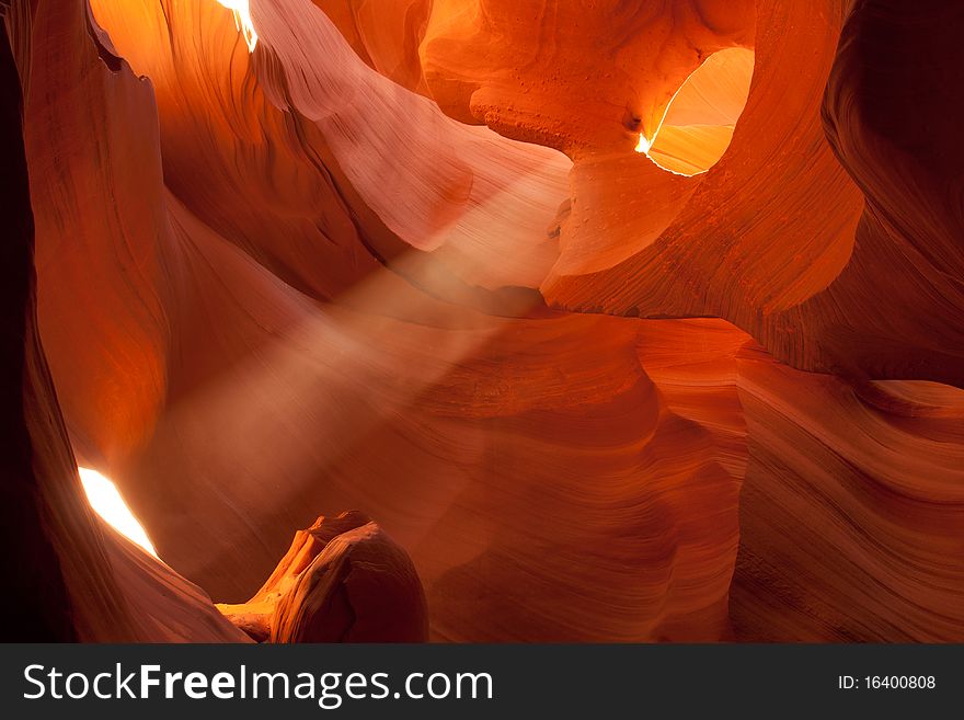 A photo of light beam taken in lower antilope canyon. A photo of light beam taken in lower antilope canyon