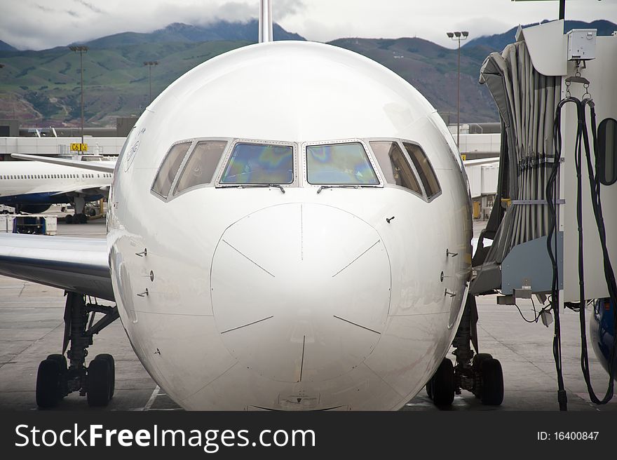 Jet Airliner Parked At Loading Gate