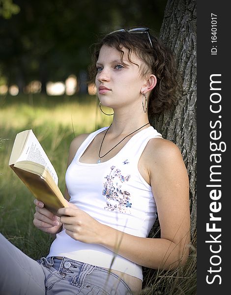 Girls Reading Book Outdoors