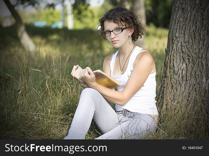 Girls Reading Book Outdoors