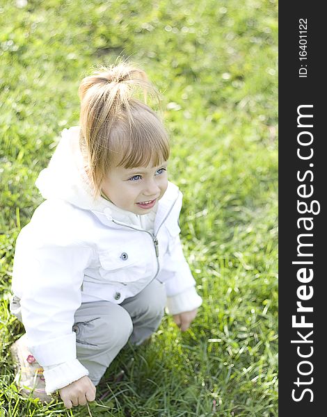 Little girl outdoors on grass