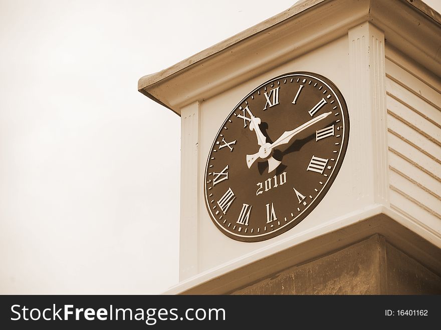 A clock face at the top of a castle tower. A clock face at the top of a castle tower