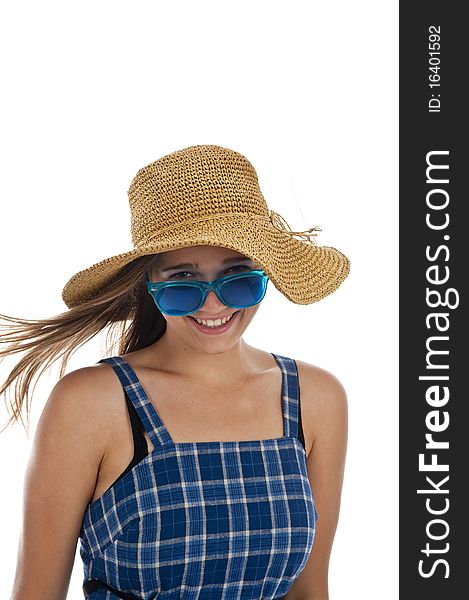 Pretty teen girl in blue sunglasses and a straw hat. Pretty teen girl in blue sunglasses and a straw hat