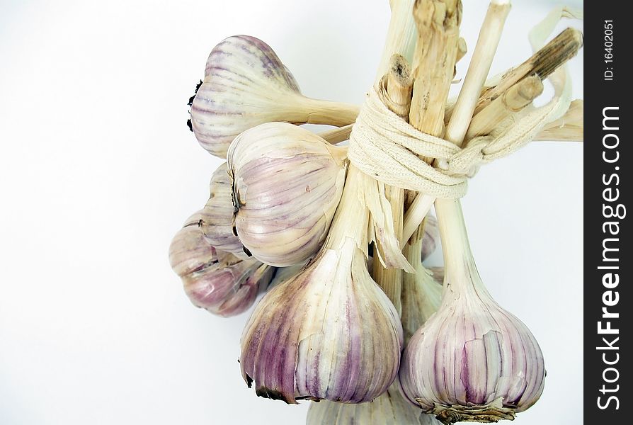Garlic is associated in a bundle for storage