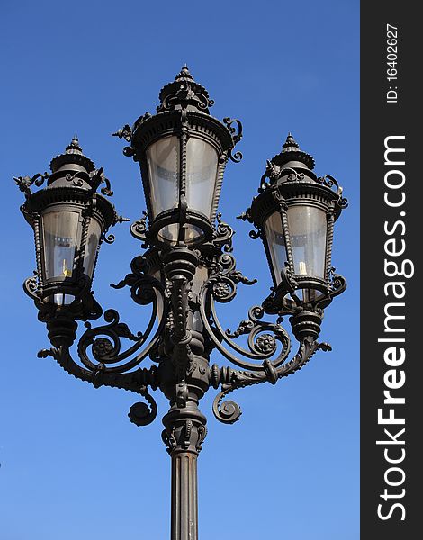 Classic designed street lamp made out of iron.