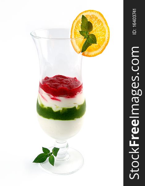 Fruit ice-cream in a glass with an orange