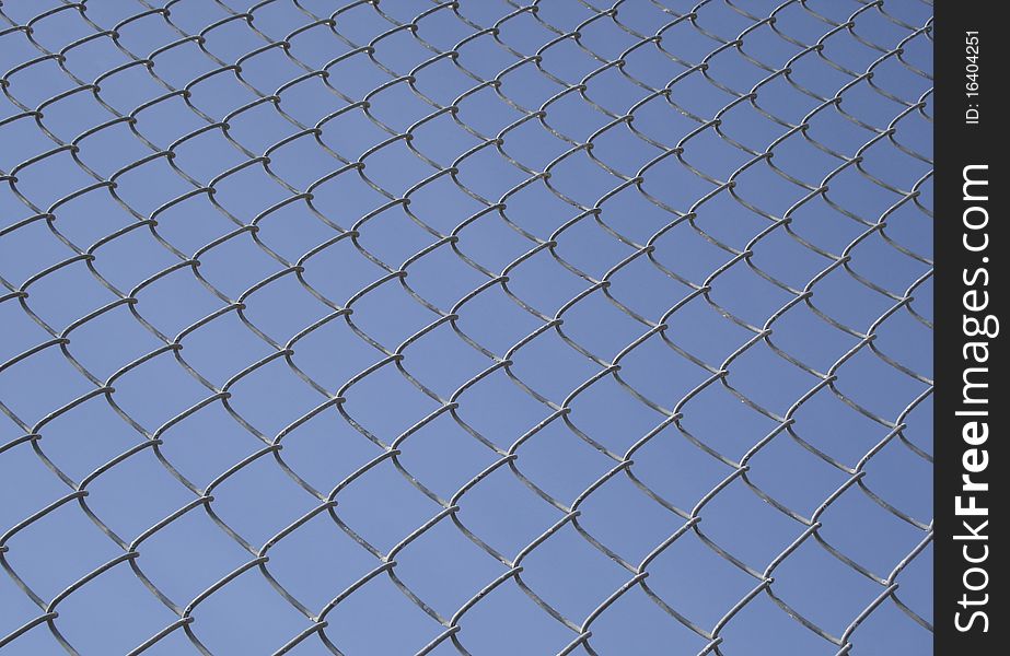 Wired fence with sky background. Wired fence with sky background