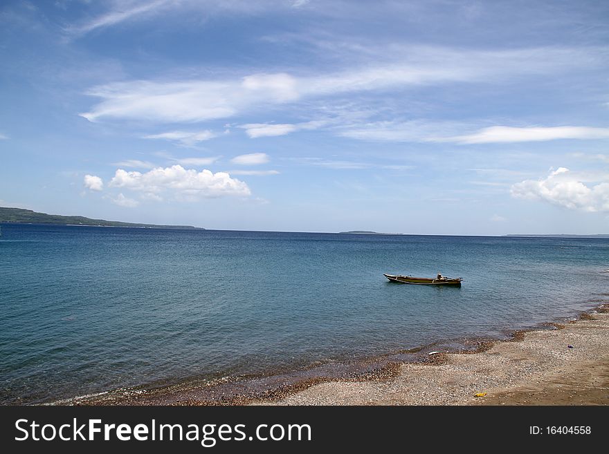 A rowboat in a very peaceful beach, at Buton Island, Southeast Sulawesi, Indonesia