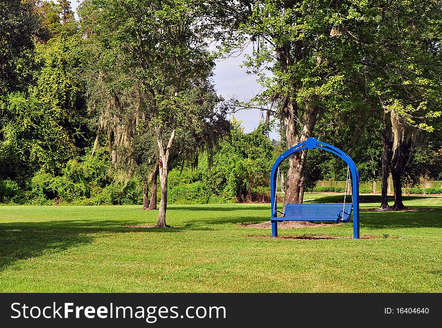 Blue Rocking Bench At A Park