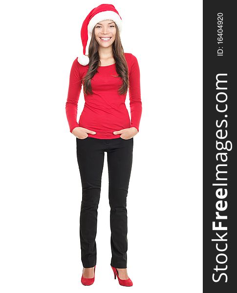 Casual christmas woman smiling standing with Santa hat isolated in full length. Asian Chinese / white Caucasian young woman on white background. Casual christmas woman smiling standing with Santa hat isolated in full length. Asian Chinese / white Caucasian young woman on white background.