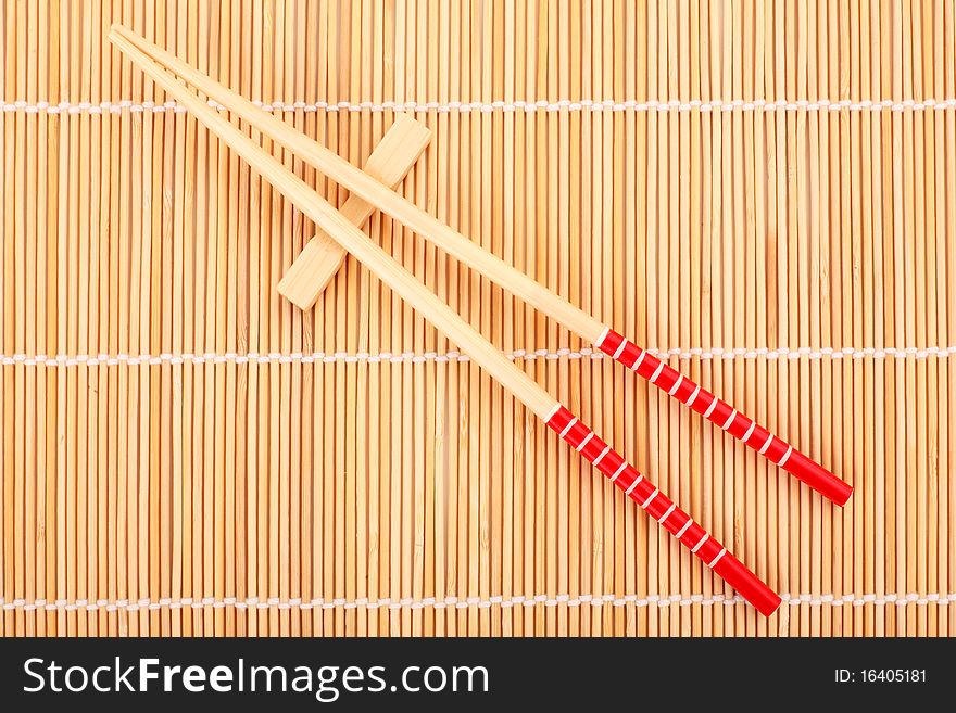 Japanese chop sticks on bamboo