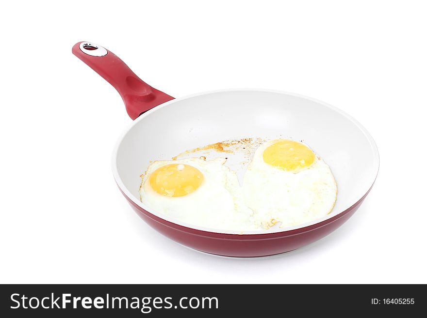 Series.Broken egg frying in a pan isolated on white