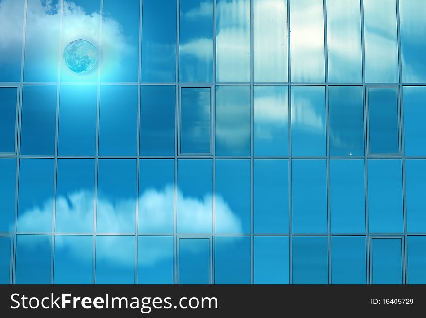 Reflexion of the moon and clouds in mirror glass of a wall of the house. Reflexion of the moon and clouds in mirror glass of a wall of the house