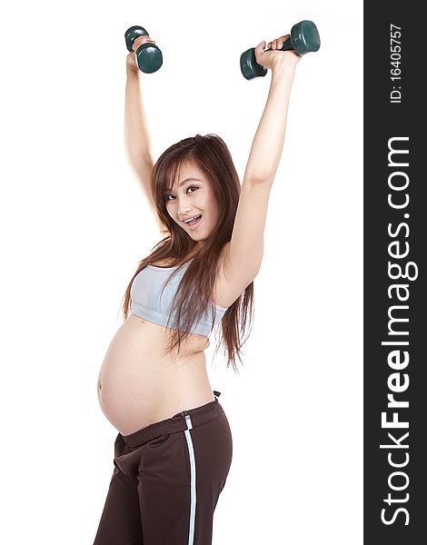 A pregnant woman is working out with weights. A pregnant woman is working out with weights