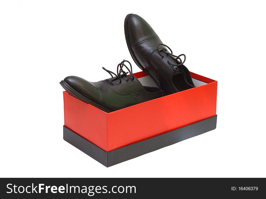 Black shoes in red box on white background