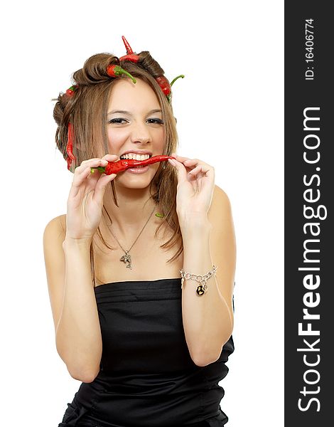 Portrait of a young woman with creative hair style with red hot chili peppers in her hair isolated on white. Portrait of a young woman with creative hair style with red hot chili peppers in her hair isolated on white